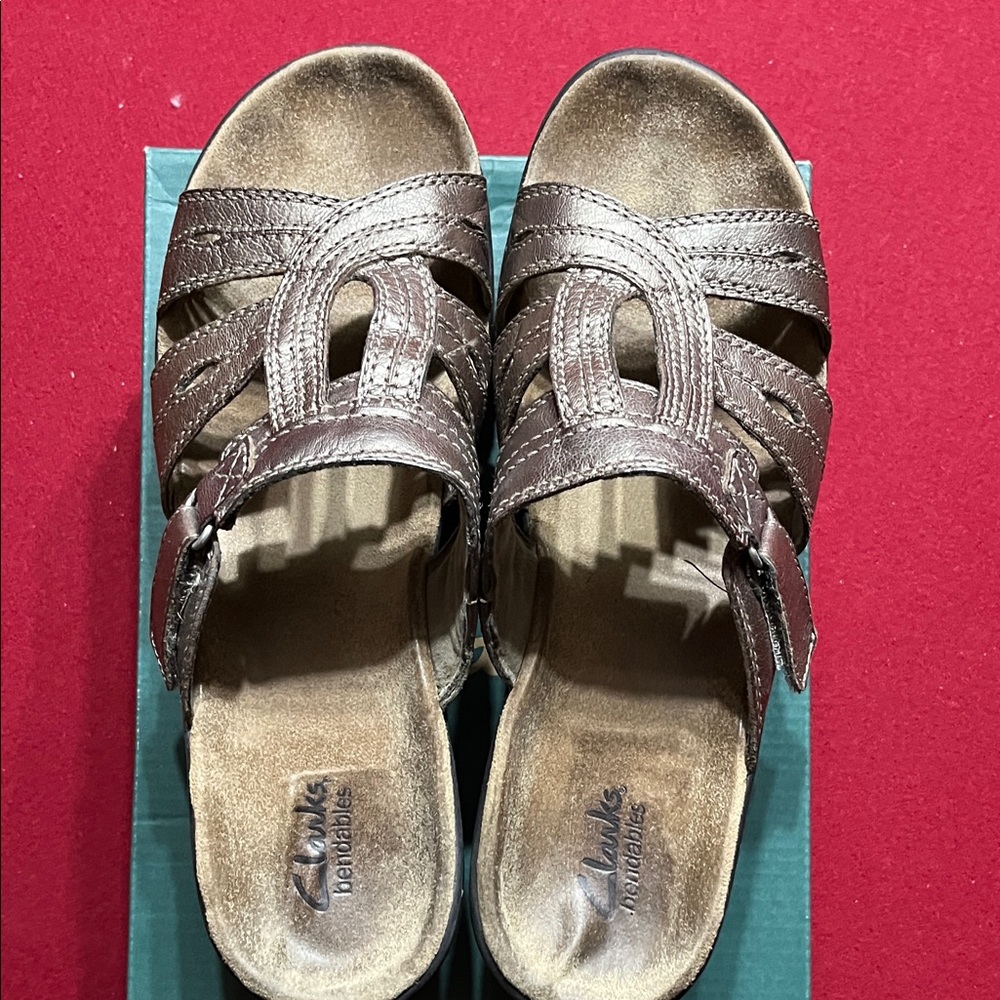 Clarks women’s gold tone slip ons